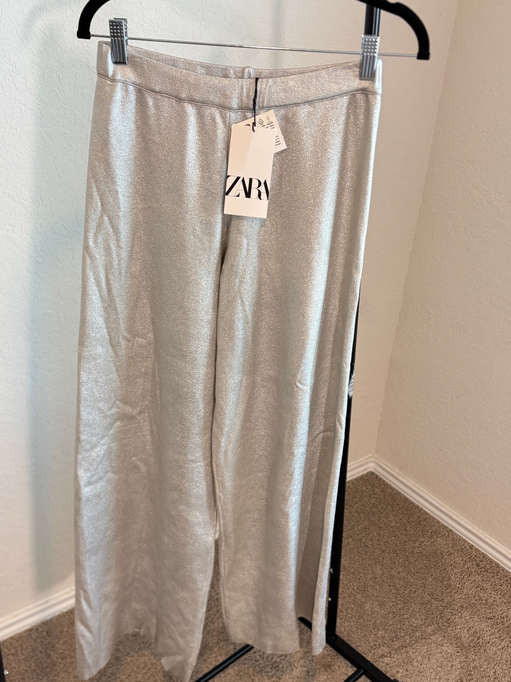 Zara Silver Metallic Wide-Leg Pants with subtle shimmering foil finish.